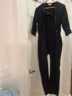 A Detacher To Be Detached Black Tailored Women's Jumpsuit with Angled Gold Zip